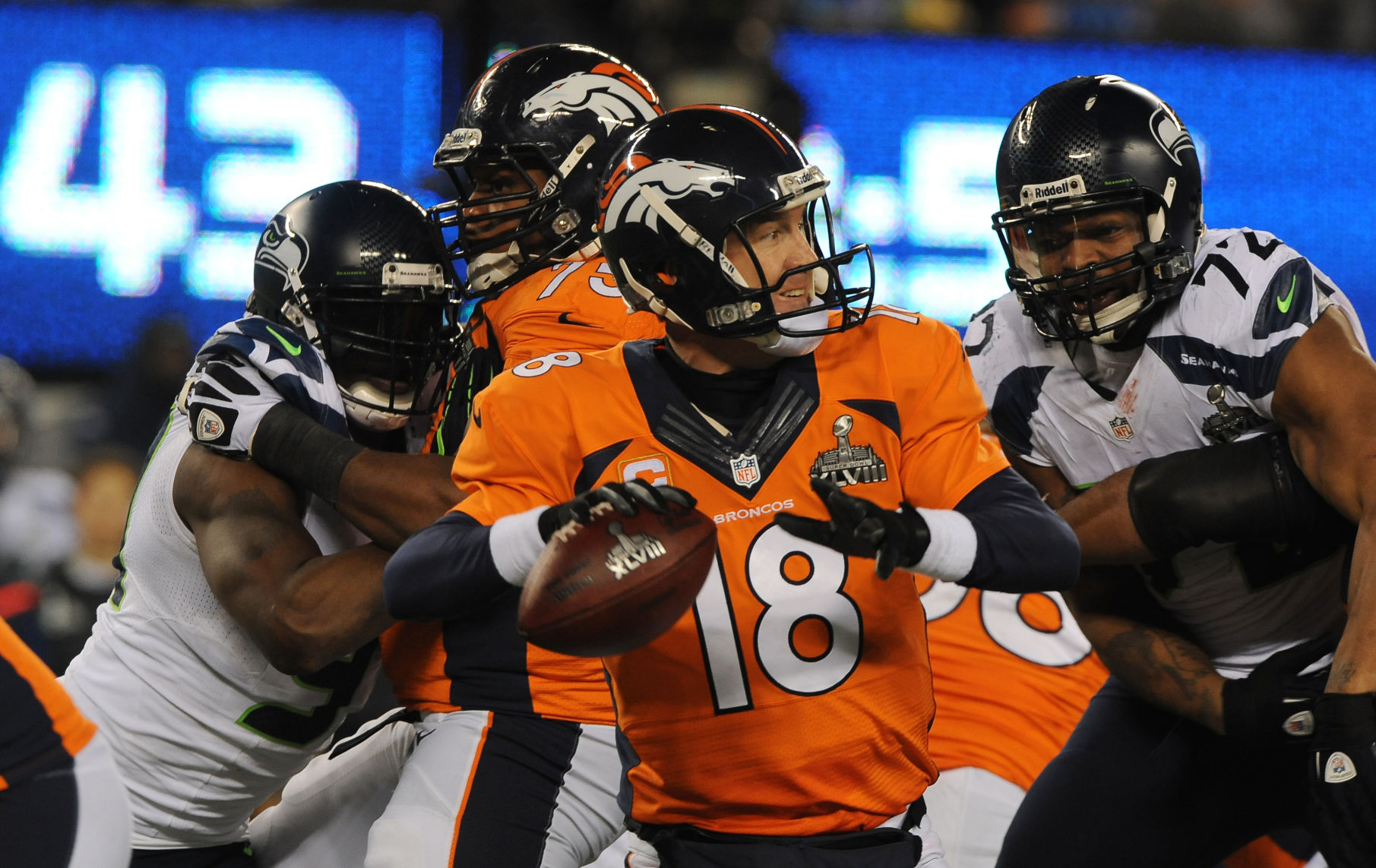 Broncos quarterback Peyton Manning is pressured by the Seahawks defense in the 4th quarter of the Super Bowl at Metlife Stadium in East Rutherford, New Jersey on February 2, 2014. (The Gazette/Jerilee Bennett)
